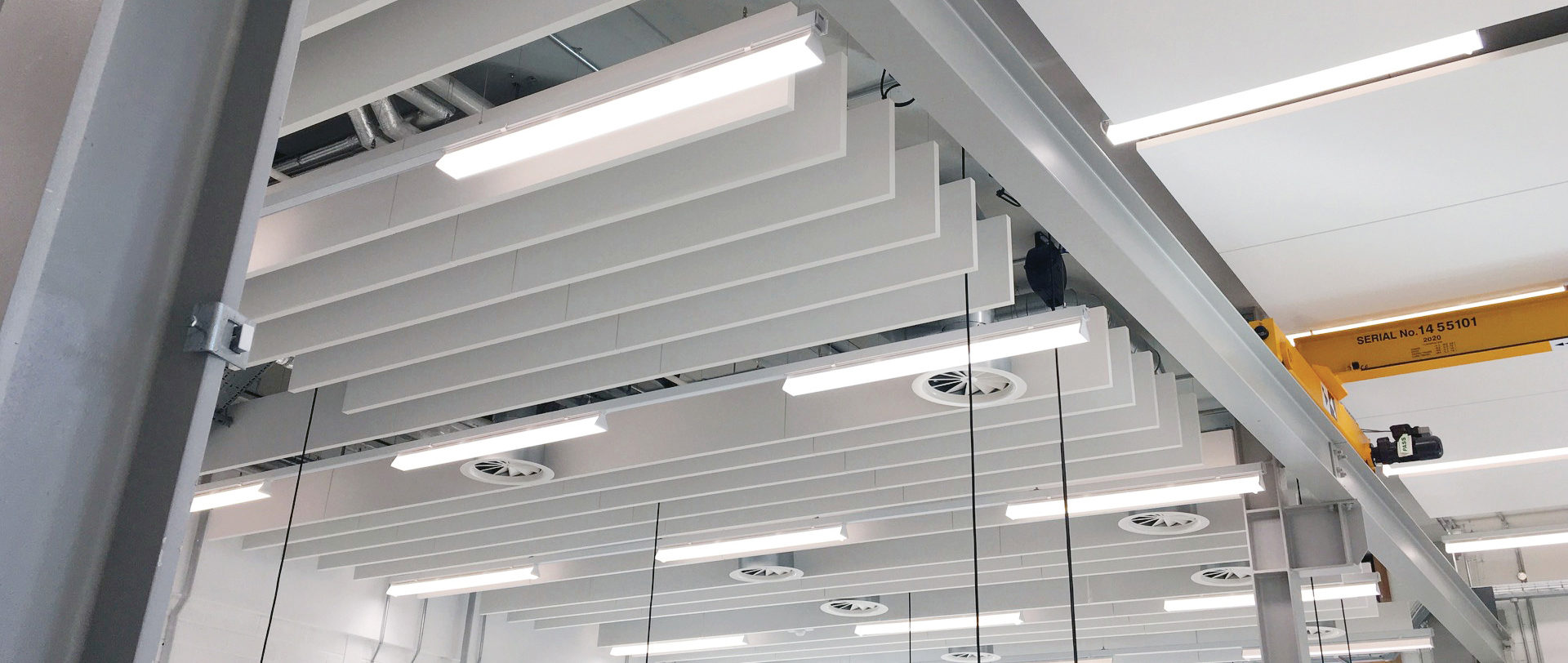 Acoustic panel suspension using Zip-Clip wire rope