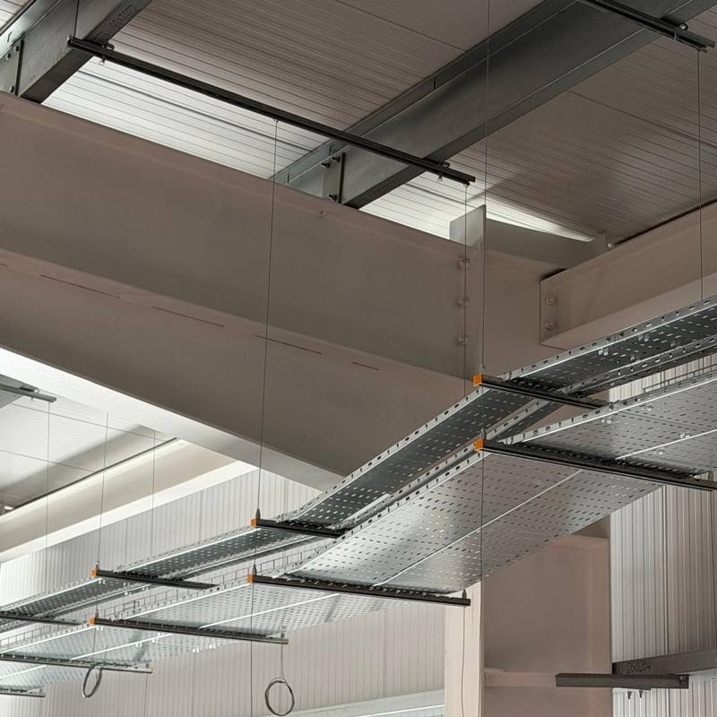 Cable tray suspended on Zip-Strut and wire across the ceiling at the Hull sports centre