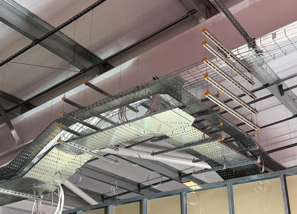 Cable tray and stacked Zip-Strut suspended on wire at the Hull sports centre